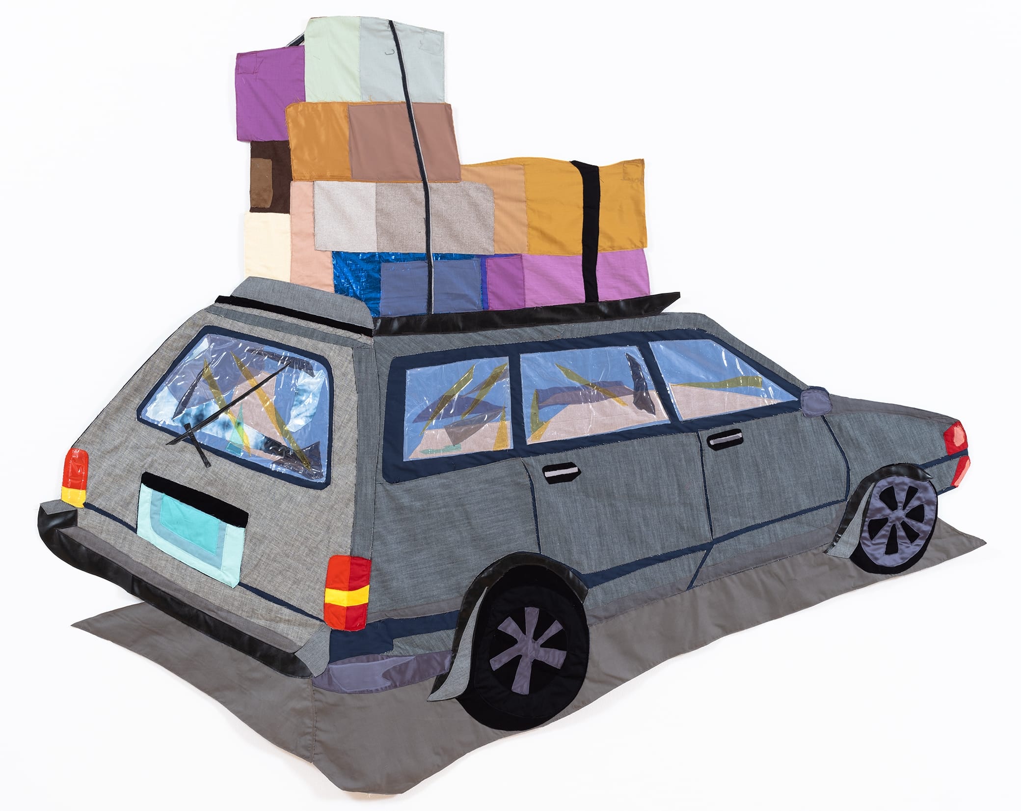 a quilt by Hangama Amiri of a gray car with boxes stacked on top