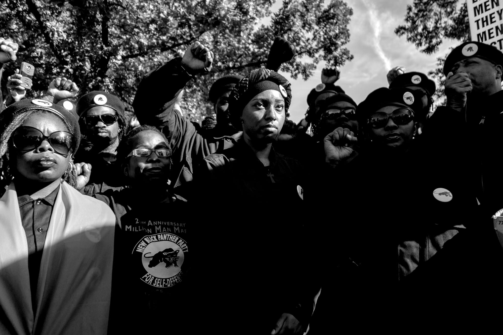 A black-and-white photograph by Carlos Javier Ortiz of members of the Black Panthers gathered on the National Mall to celebrate 20 years since the Million Man March