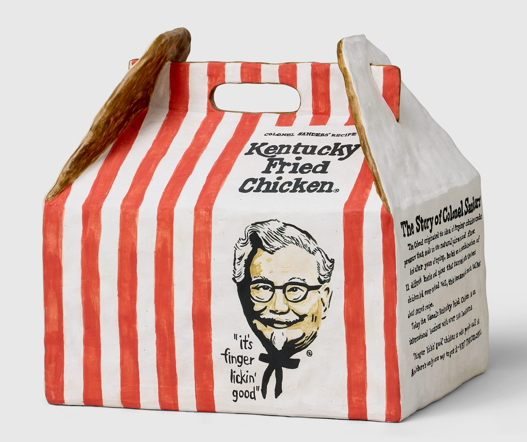 a ceramic kfc box with a portrait of colonel anders