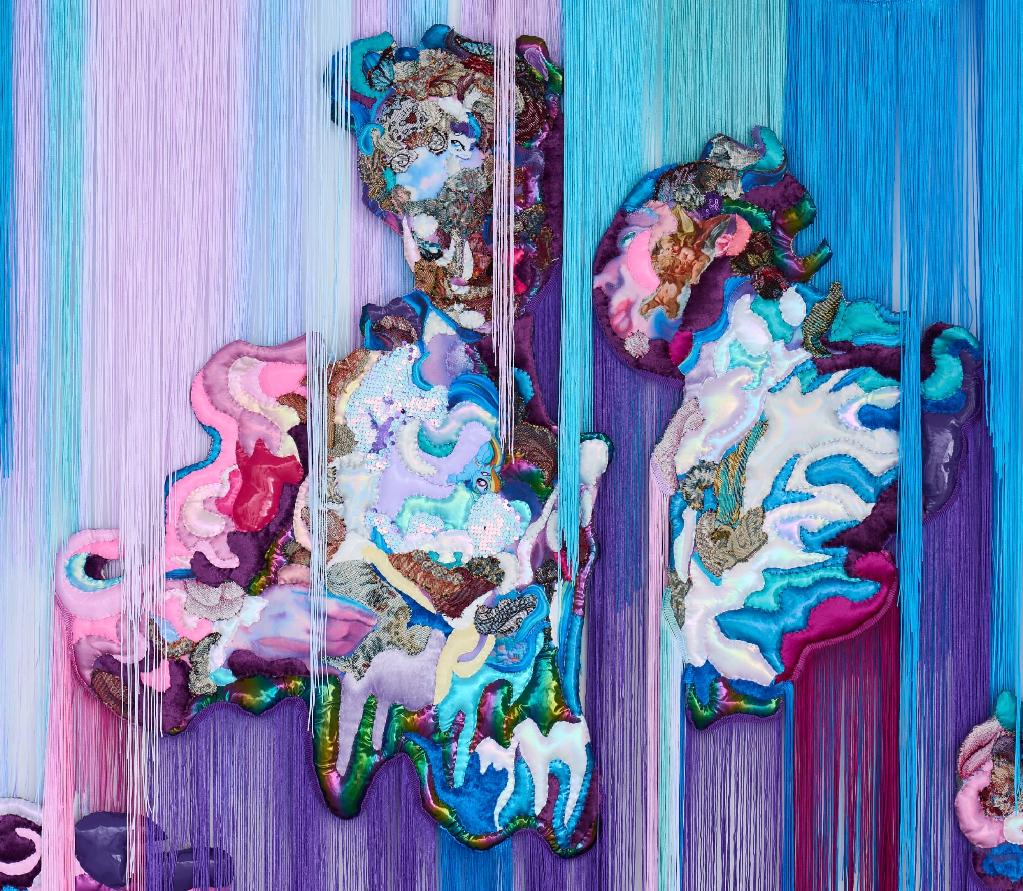 a monumental, abstract wall installation by Anne von Freyburg that appears to be cascading in purple, teal, and pink hues