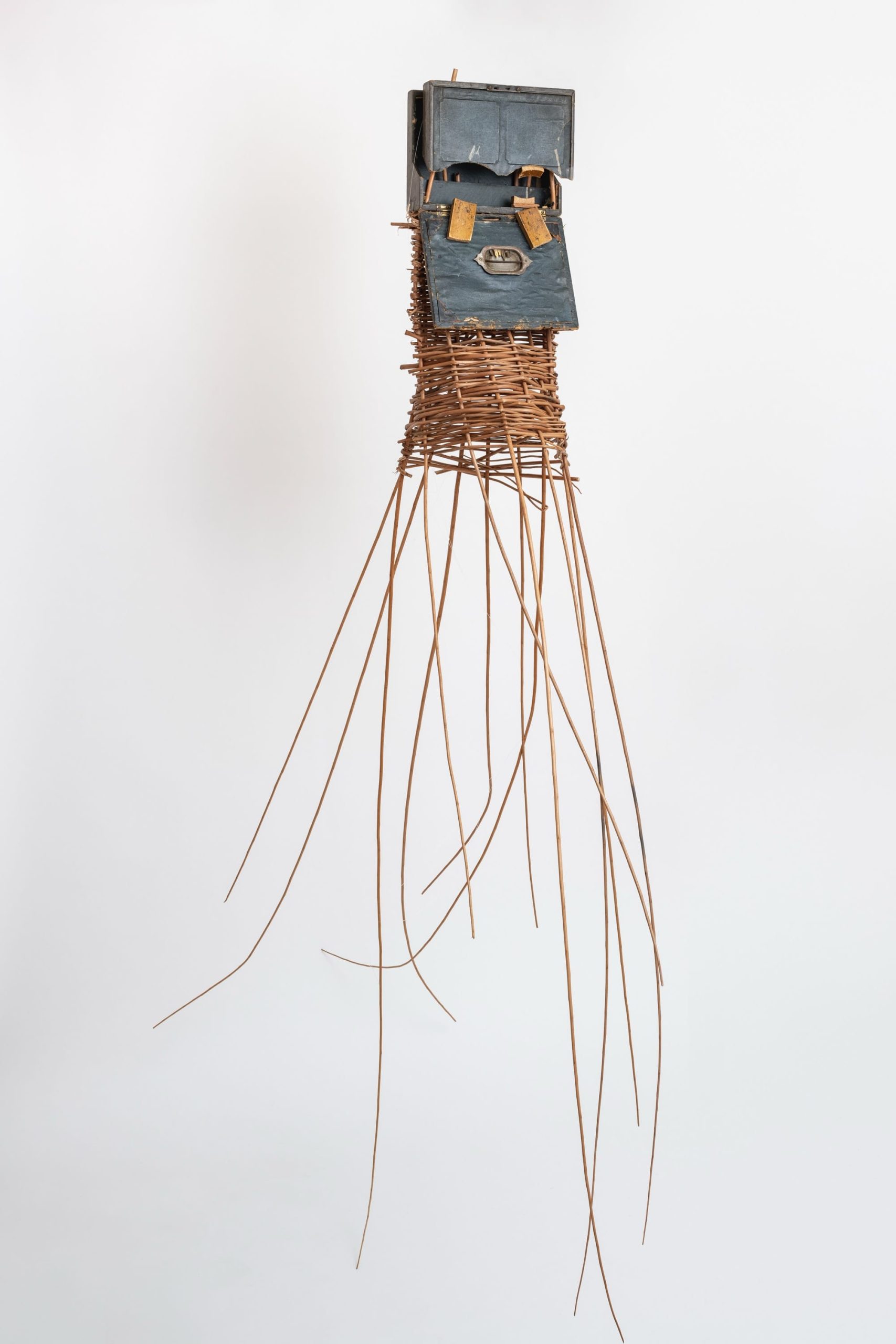 a sculptural mask inspired by African ceremonial masks, made from a colonial-era writing desk