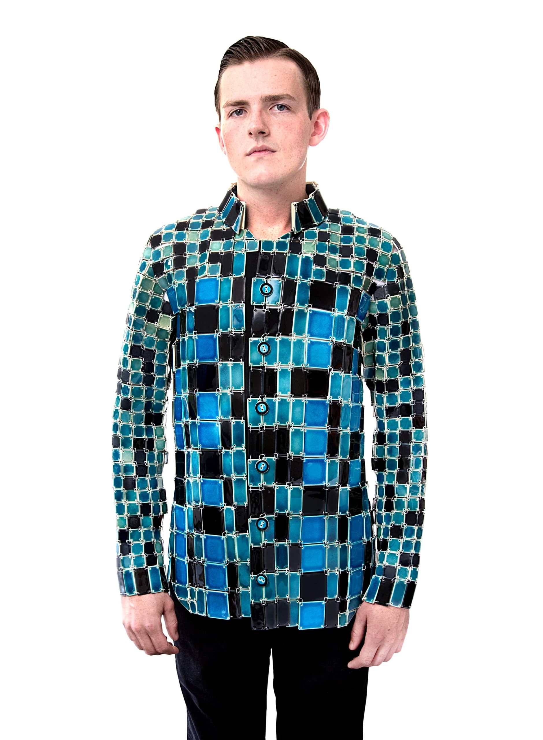 Shae Bishop wears a blue and black tile button up shirt