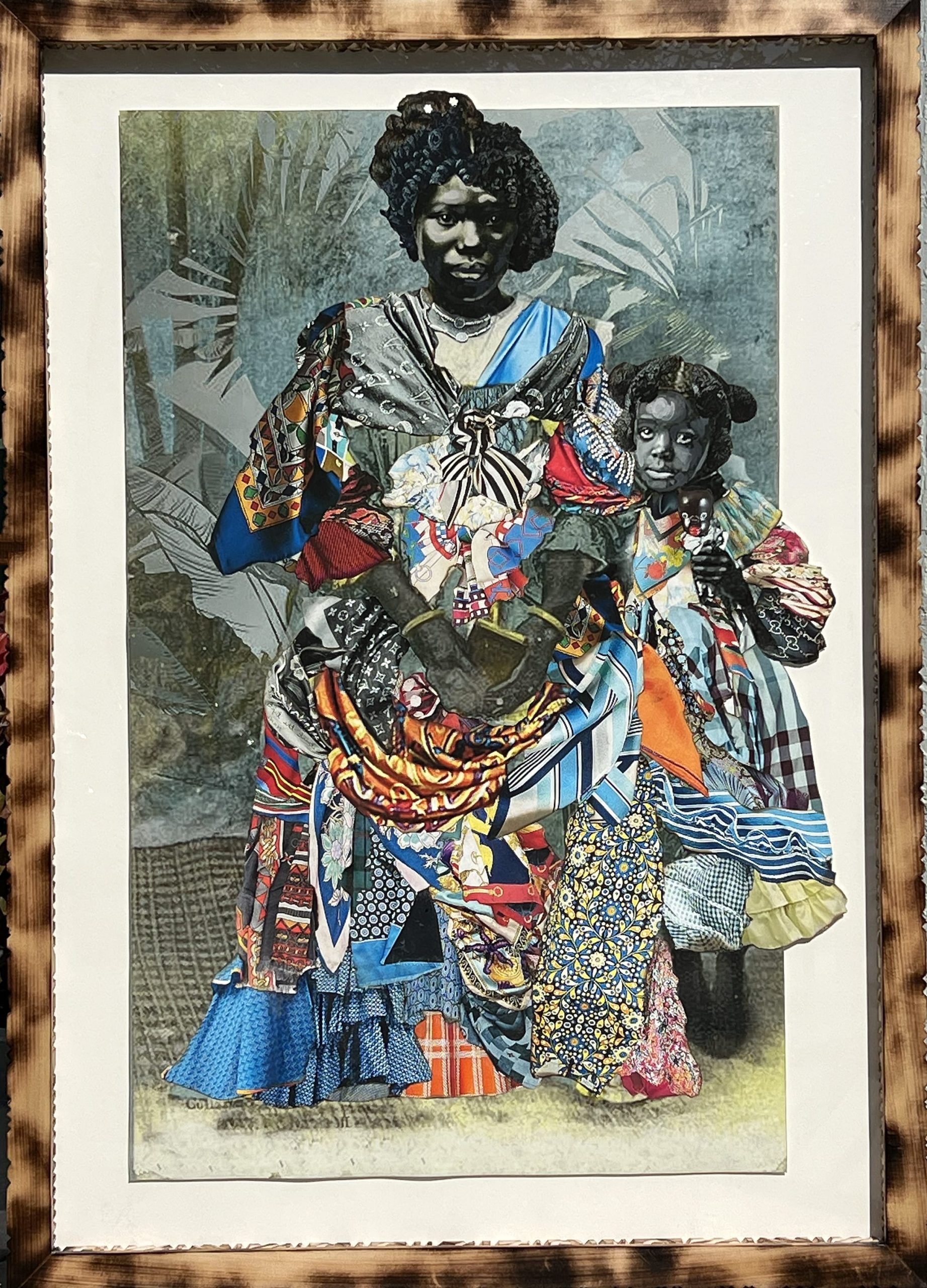 a framed portrait by Stan Squirewell, from an old photograph, of a Black woman and a young girl, with colorful, patterned fabrics collaged onto the image