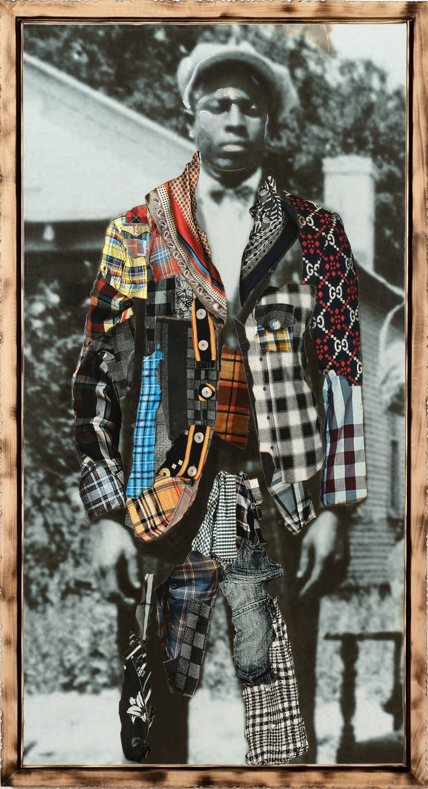a framed portrait by Stan Squirewell, from an old photograph, of a Black man with colorful, patterned fabrics collaged onto the image